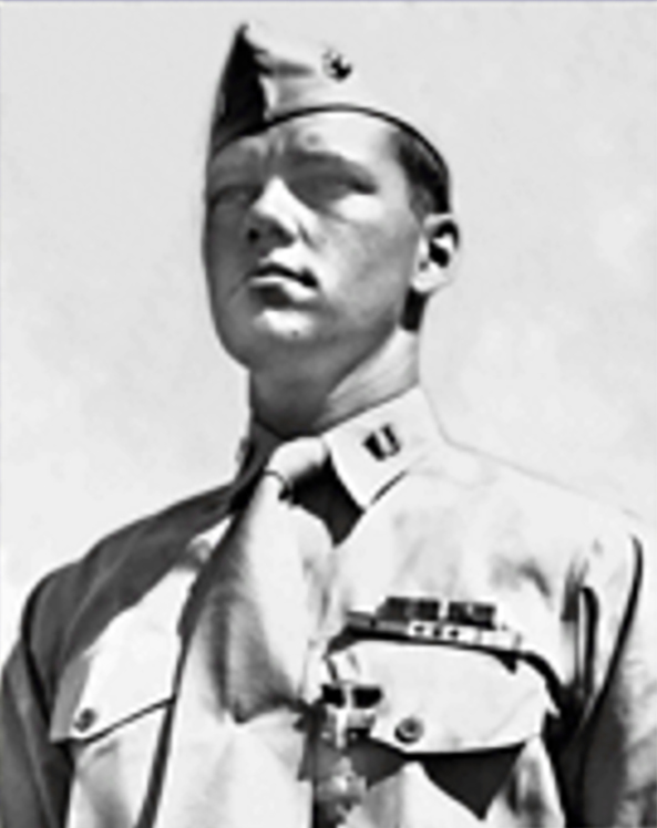 A stern-faced Captain Eddy wears the Navy Cross earned on Iwo Jima.